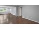 Bright living room featuring hardwood floors, neutral paint, and lots of natural light from large windows at 856 Bridgewater Sw St, Atlanta, GA 30310