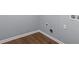 An empty room featuring luxury vinyl flooring and a gray painted wall at 856 Bridgewater Sw St, Atlanta, GA 30310