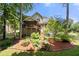 Exterior view of home highlighting screened porch, landscaped backyard, and multi-level deck at 2214 Trilleck Nw Dr, Kennesaw, GA 30152