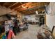 Unfinished basement used for storage featuring exposed ceiling beams and an assortment of boxes and containers at 2214 Trilleck Nw Dr, Kennesaw, GA 30152
