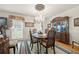Elegant dining room with hardwood floors, chandelier lighting, and classic furnishings at 2214 Trilleck Nw Dr, Kennesaw, GA 30152