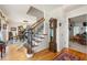 Inviting foyer with hardwood floors and staircase leading to the upper level at 2214 Trilleck Nw Dr, Kennesaw, GA 30152