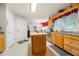 Functional kitchen features tile flooring, wooden island, and ample counter space at 2214 Trilleck Nw Dr, Kennesaw, GA 30152