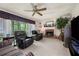 Inviting living room features a fireplace, large window, and comfortable seating at 2214 Trilleck Nw Dr, Kennesaw, GA 30152