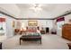 Spacious main bedroom suite featuring a vaulted ceiling, patterned border, and doorway to the ensuite bathroom at 2214 Trilleck Nw Dr, Kennesaw, GA 30152