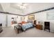Comfortable main bedroom featuring ceiling fan and a door that opens to the bathroom at 2214 Trilleck Nw Dr, Kennesaw, GA 30152