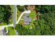 Aerial view showcasing the home's sprawling lot, driveway, mature landscaping, and surrounding greenery at 313 Anderwood Rdg, Marietta, GA 30064