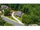 Aerial shot of home showcasing the circular driveway, professional landscaping, and wooded surroundings at 313 Anderwood Rdg, Marietta, GA 30064
