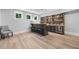 Finished basement bar features custom shelving, cabinets, wine fridge, and three windows for ample sunlight at 313 Anderwood Rdg, Marietta, GA 30064