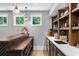 Finished basement wet bar featuring custom shelving, a built-in sink, and a mini-fridge at 313 Anderwood Rdg, Marietta, GA 30064