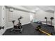 Basement gym featuring a stationary bike, weight bench, and various exercise equipment at 313 Anderwood Rdg, Marietta, GA 30064
