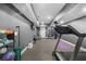 Finished basement gym featuring a treadmill, elliptical, and a weight rack at 313 Anderwood Rdg, Marietta, GA 30064