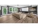 Basement with a home theater setup, large sofa, and natural light from the walk-out exit to the backyard at 313 Anderwood Rdg, Marietta, GA 30064