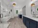 Bright primary bathroom with a glass shower, soaking tub, double vanity, and neutral color palette at 313 Anderwood Rdg, Marietta, GA 30064