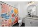 Charming bathroom with floral shower curtain, updated vanity, and modern fixtures providing a comfortable atmosphere at 313 Anderwood Rdg, Marietta, GA 30064