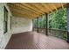 Expansive wooden deck with exposed beams, offering a great outdoor space for relaxation and entertainment at 313 Anderwood Rdg, Marietta, GA 30064