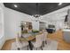 A dining room with a black, coffered ceiling, chandelier and decor at 313 Anderwood Rdg, Marietta, GA 30064