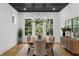 The dining room is spacious and bright with large windows and comfortable seating at 313 Anderwood Rdg, Marietta, GA 30064