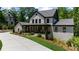 Beautiful two-story home with a front porch and a long driveway at 313 Anderwood Rdg, Marietta, GA 30064