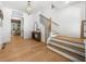 Inviting foyer featuring wood floors, stairs with black wrought iron spindles, and a view to the living area at 313 Anderwood Rdg, Marietta, GA 30064