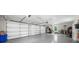 Spacious three car garage with epoxy flooring and organized storage at 313 Anderwood Rdg, Marietta, GA 30064