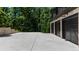 Spacious three-car garage with ample driveway space, showcasing a modern design at 313 Anderwood Rdg, Marietta, GA 30064