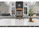 A modern kitchen has gray cabinets, stainless steel appliances, and a large island with seating at 313 Anderwood Rdg, Marietta, GA 30064