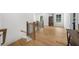 Upstairs hallway landing with hardwood floors and natural light from windows at 313 Anderwood Rdg, Marietta, GA 30064