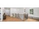 Bright landing area with hardwood floors and a black metal and wood banister at 313 Anderwood Rdg, Marietta, GA 30064