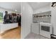 Well-organized laundry room with modern washer and dryer and storage shelves at 313 Anderwood Rdg, Marietta, GA 30064