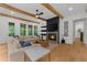 Inviting living room with coffered ceiling, fireplace, and large windows offering serene views of the outdoors at 313 Anderwood Rdg, Marietta, GA 30064