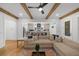 Bright open-concept living room featuring hardwood floors, wooden beams, and seamless flow to the modern kitchen at 313 Anderwood Rdg, Marietta, GA 30064