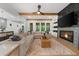 Cozy living room with fireplace, wood beams, hardwood floors, and plenty of natural light at 313 Anderwood Rdg, Marietta, GA 30064