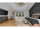 Main bedroom showcasing a ceiling fan, light wood floors, and a view of the outdoors at 313 Anderwood Rdg, Marietta, GA 30064