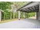 Expansive back porch with a covered pavilion-style roof, ideal for outdoor entertaining in a lush backyard setting at 4959 Abbotts Glen, Acworth, GA 30101