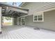 A large covered back porch extending from the house, offering ample space for relaxing and outdoor activities at 4959 Abbotts Glen, Acworth, GA 30101