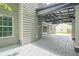 A spacious back porch area featuring a covered section and offering a seamless transition to the backyard at 4959 Abbotts Glen, Acworth, GA 30101