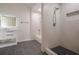 Well-lit bathroom boasts stylish tile flooring, shower, bathtub, and a modern vanity with a large mirror at 4959 Abbotts Glen, Acworth, GA 30101