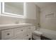 Modern bathroom featuring a vanity with a lighted mirror and tiled shower at 4959 Abbotts Glen, Acworth, GA 30101