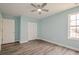 Bedroom with wood floors, a window, a ceiling fan, and a closet at 4959 Abbotts Glen, Acworth, GA 30101