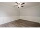 Cozy bedroom with decorative trim, ceiling fan, and wood-look flooring at 4959 Abbotts Glen, Acworth, GA 30101