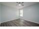 Bright bedroom with a ceiling fan, hardwood floors, and a window that provides natural light at 4959 Abbotts Glen, Acworth, GA 30101