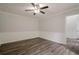 Well-lit bedroom with wood-look floors, ceiling fan, and fresh paint at 4959 Abbotts Glen, Acworth, GA 30101