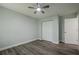 Bedroom with a ceiling fan, closet, and hardwood floors at 4959 Abbotts Glen, Acworth, GA 30101