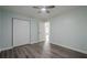 This bedroom features a ceiling fan, closet, hardwood floors, and neutral-colored walls at 4959 Abbotts Glen, Acworth, GA 30101