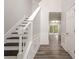 Inviting entryway featuring hardwood flooring, a staircase, and views into the living space at 4959 Abbotts Glen, Acworth, GA 30101