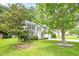 Charming gray two-story home with well-manicured lawn and mature trees at 4959 Abbotts Glen, Acworth, GA 30101