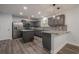 Updated kitchen featuring gray cabinets, granite countertops, stainless steel appliances, and a center island at 4959 Abbotts Glen, Acworth, GA 30101