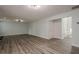 Large living room with wood floors, and a view to a staircase at 4959 Abbotts Glen, Acworth, GA 30101