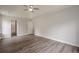 This main bedroom features a ceiling fan, hardwood floors, and neutral-colored walls at 4959 Abbotts Glen, Acworth, GA 30101